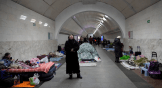 People gather in the Kyiv subway, using it as a bomb shelter.