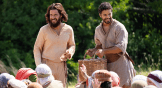 Jesus and Simon the Zealot feed the hungry crowd.