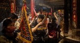 People pay their respects to the sea goddess, Mazu, at a temple in Taiwan during the first day of the 2023 Dajia Mazu Pilgrimage.