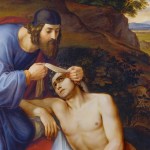 A historic painting of the good samaritan where the samaritan is bandaging the man's injured head with the priest walking away in the background