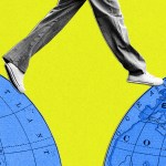 A person's feet stepping over a gap in between two maps of the earth.
