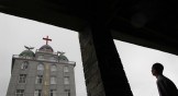 A man looking at the Lingbo Church in China.