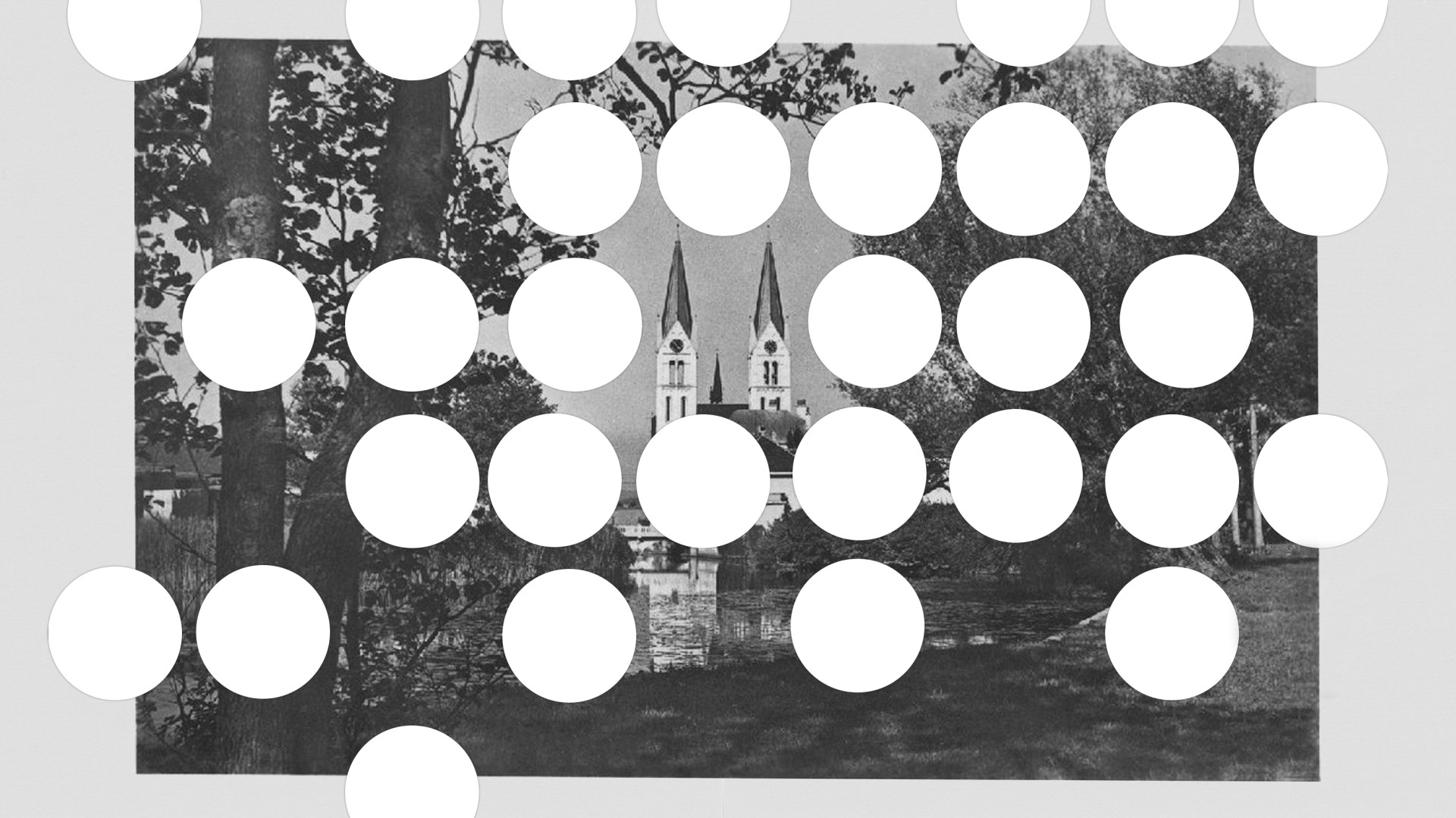 A church surrounded by circles that are cutout.