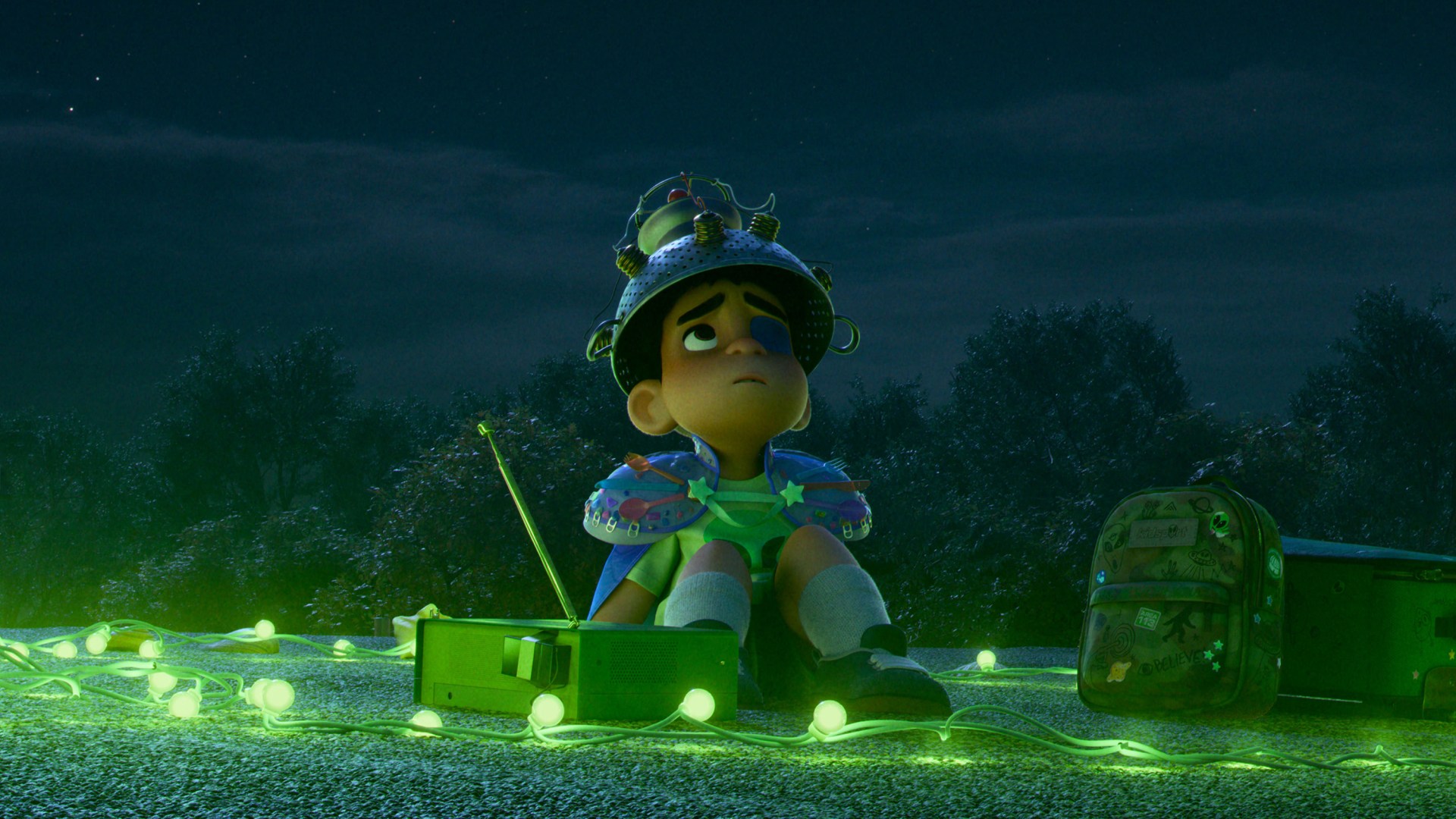 A still from the movie showing Elio looking up at the night sky.