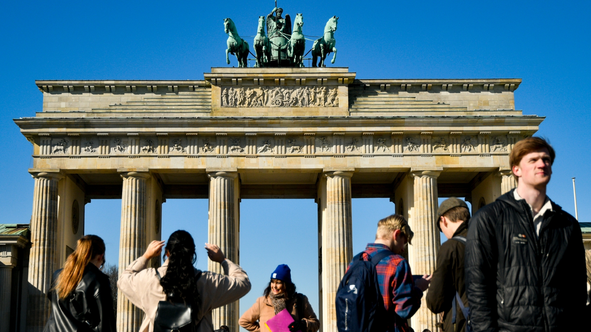 Young people in front of the Brandenburg Gate in Berlin