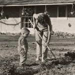 A mom and son gardening.