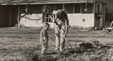 A mom and son gardening.